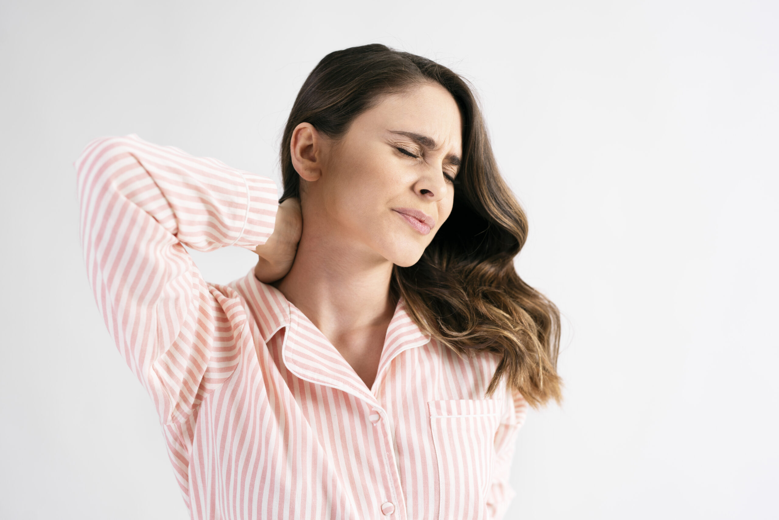 Young woman suffering from neck pain