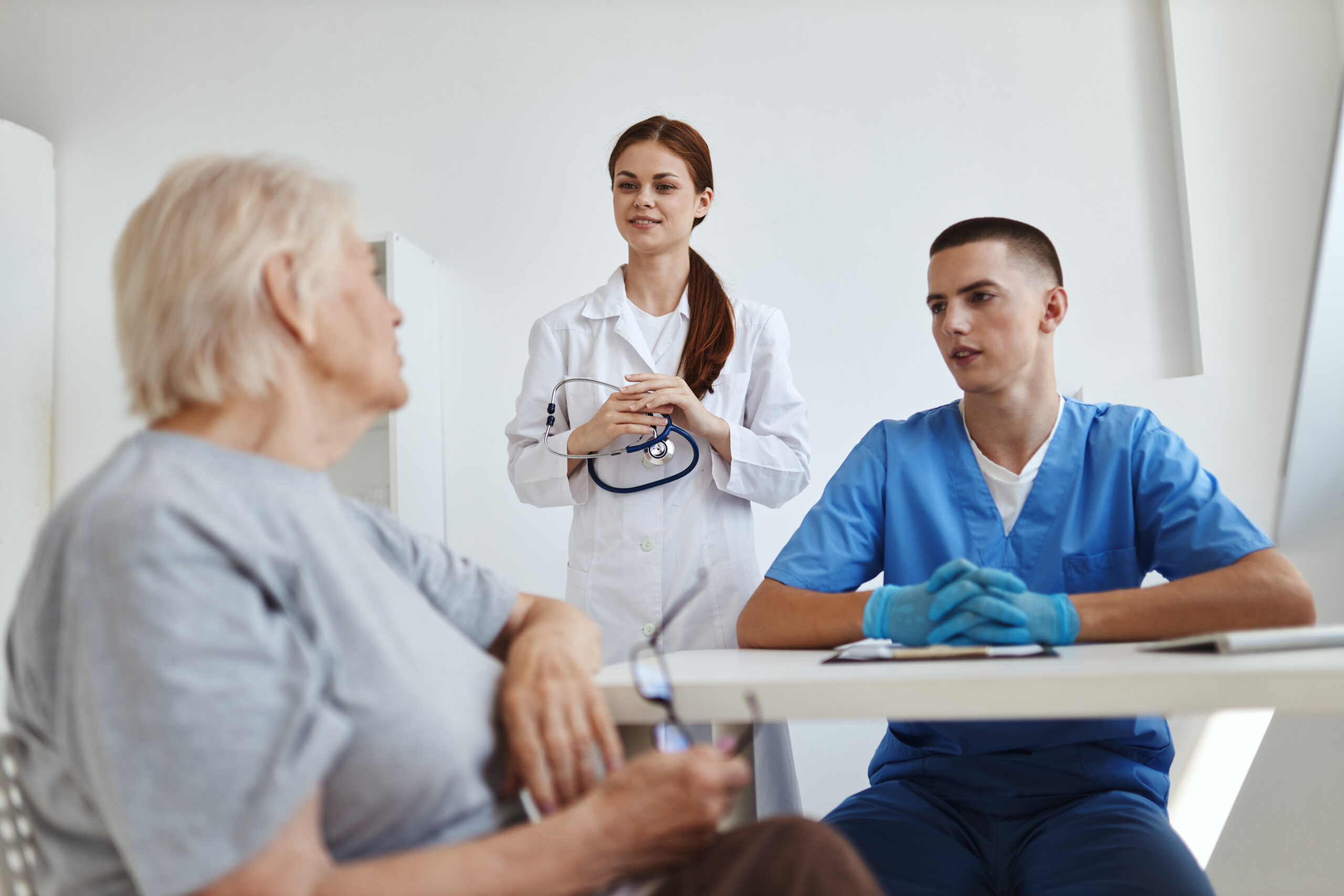 doctor and nurse taking patient in hospital diagnostics service. High quality photo